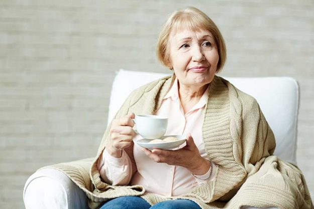 Elderly woman enjoying tea Elderly woman enjoying tea
