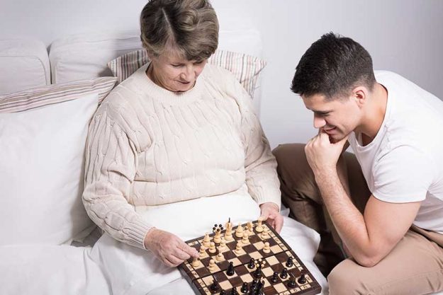 Man playing with grandmother