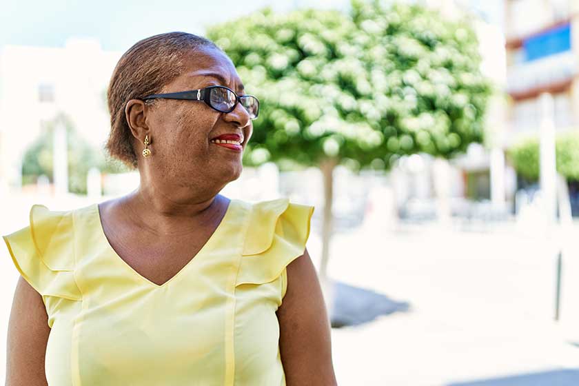 Senior african american woman smiling happy standing at the city