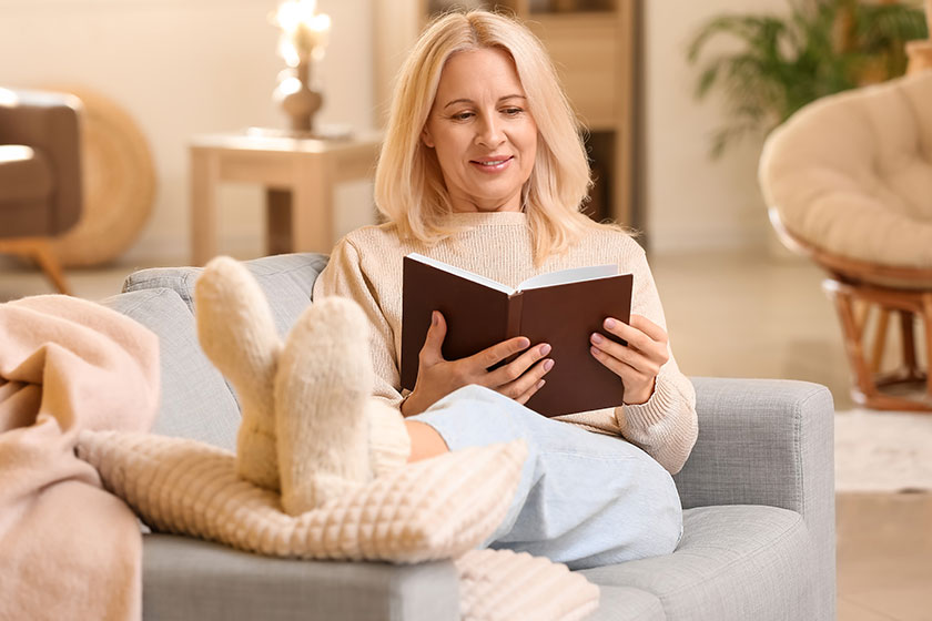 Beautiful mature woman reading book Beautiful mature woman reading book