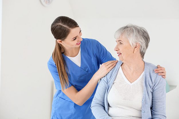 Female doctor with senior woman suffering from Park Female doctor with senior woman suffering from Park