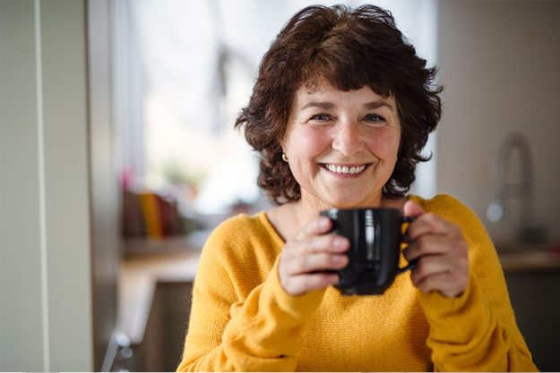 Senior woman with cup of coffee at home Senior woman with cup of coffee at home