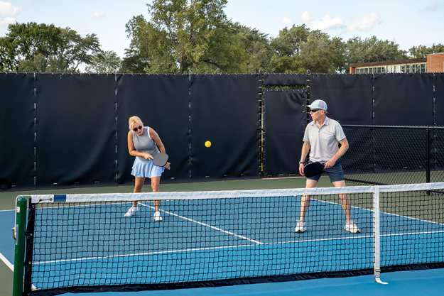 A female pickleball player A female pickleball player
