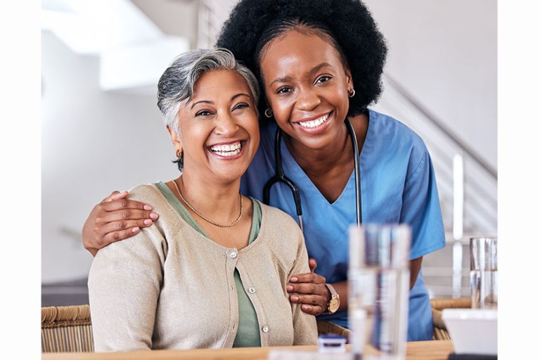 Portrait, smile and assisted living caregiver with an old woman