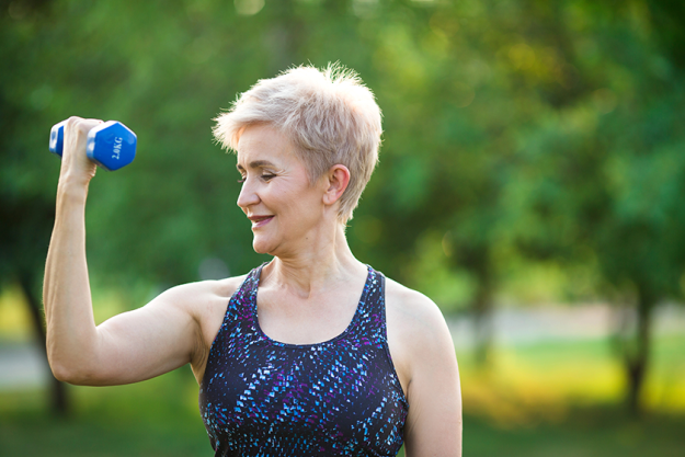 Stylish elderly woman with short hairstyle doing sports Stylish elderly woman with short hairstyle doing sports