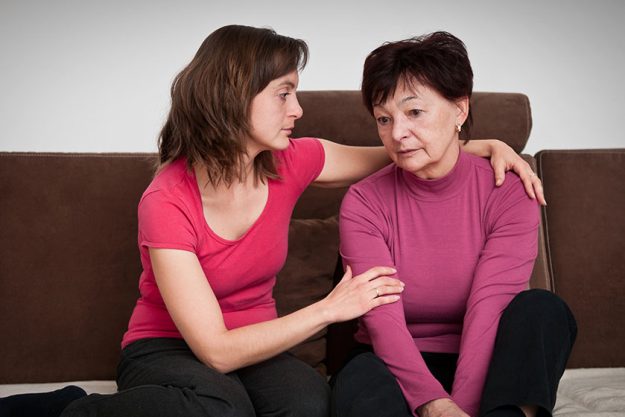 Daughter comforts senior mother Daughter comforts senior mother
