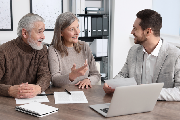 Elderly couple consulting insurance agent