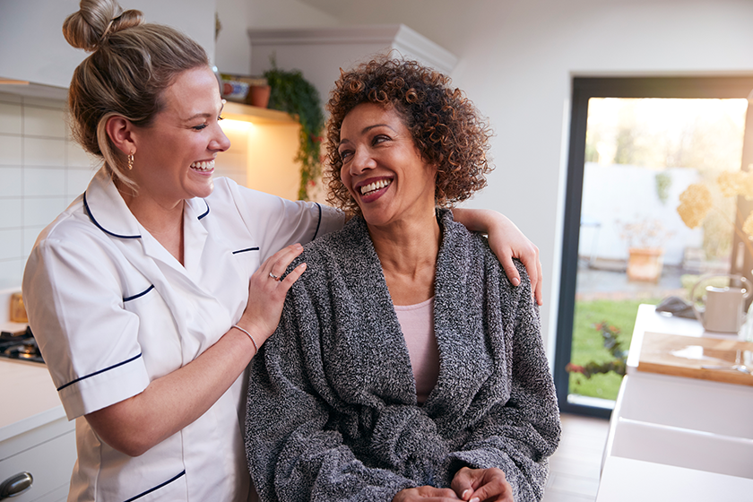 Mature Woman In Dressing Gown Talking With Female