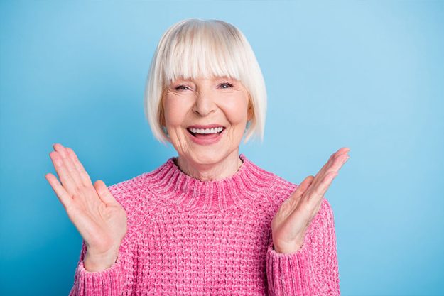 Portrait of satisfied healthy aged person smile