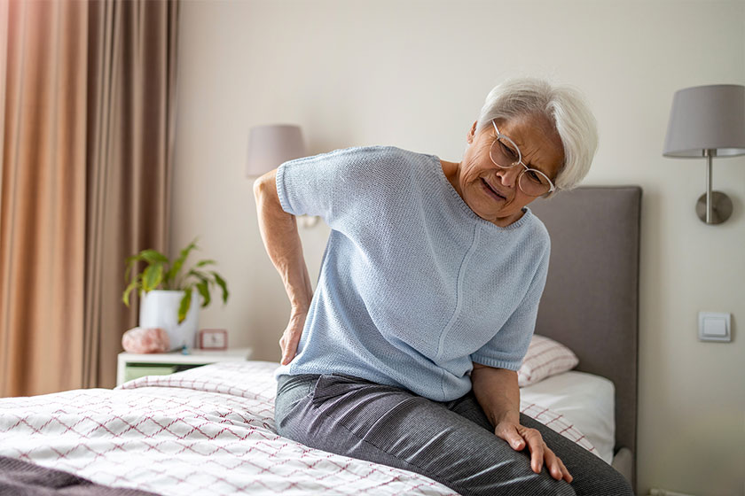 Senior woman suffering from back pain Senior woman suffering from back pain