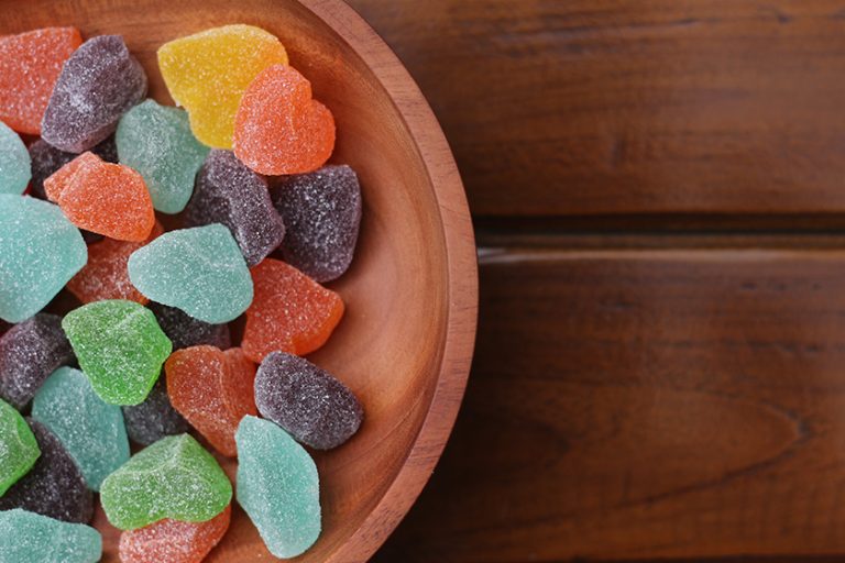 close gummy candies various colors fruit flavors served wooden bowl close gummy candies various colors fruit flavors served wooden bowl