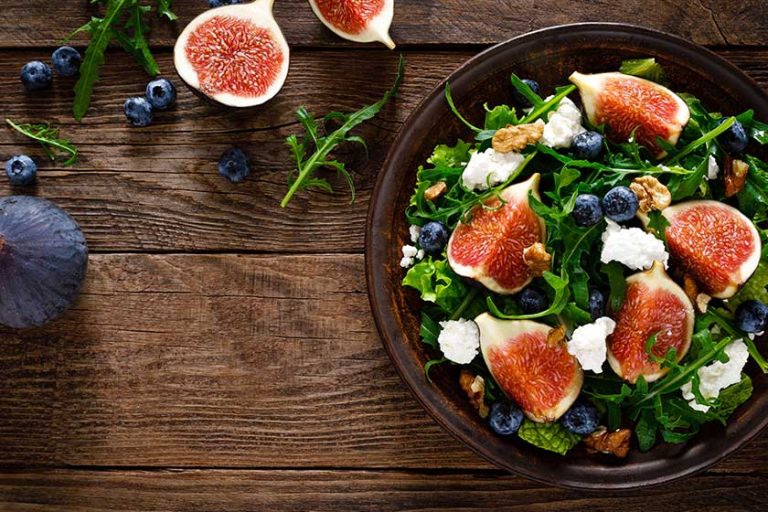 fig salad goat cheese blueberry walnuts arugula wooden background healthy fig salad goat cheese blueberry walnuts arugula wooden background healthy