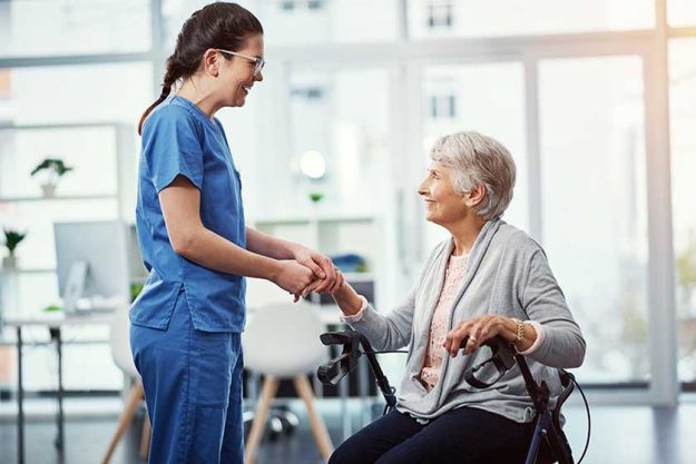 glad youre happy here young female nurse talking her senior glad youre happy here young female nurse talking her senior