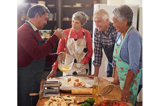 if theres a whisk theres a way shot of a group of seniors cooking in if theres a whisk theres a way shot of a group of seniors cooking in