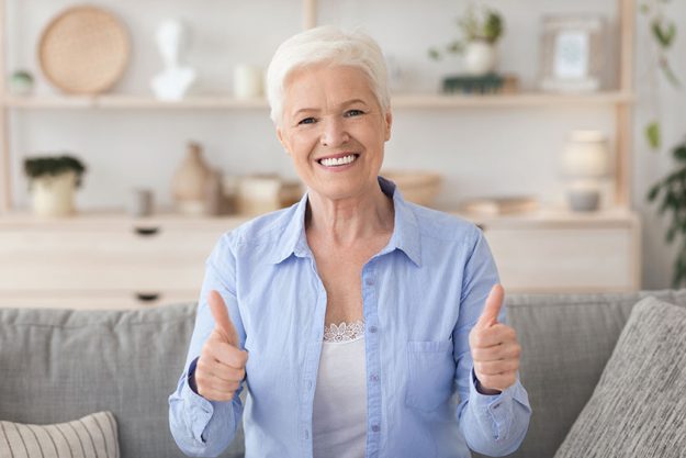 Life Insurance For Retirement. Happy Senior Lady Showing Thumb Up At Camera