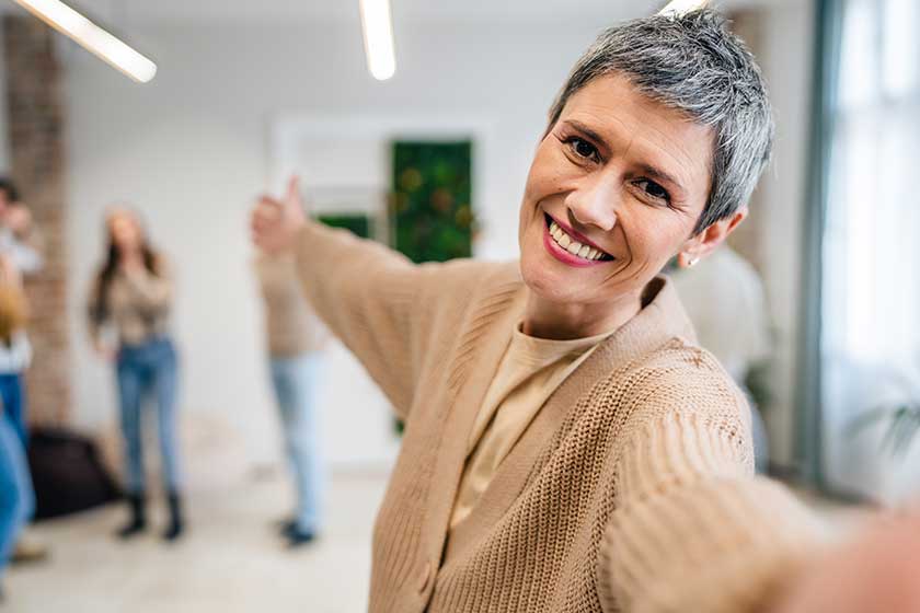 Portrait senior woman front group people men women colleagues portrai Portrait senior woman front group people men women colleagues portrai