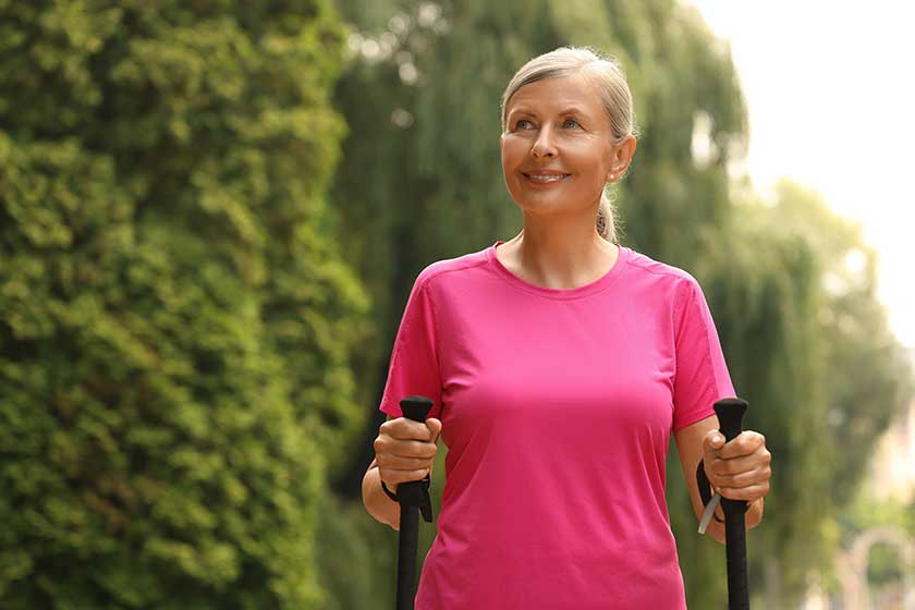 senior woman nordic walking poles outdoors space text senior woman nordic walking poles outdoors space text