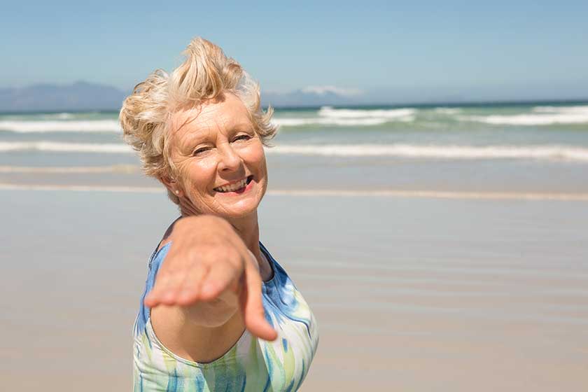 senior woman standing against clear sky