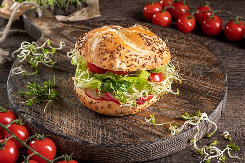 veggie burger fresh radish fenugreek sprouts broccoli microgreens tomatos rustic