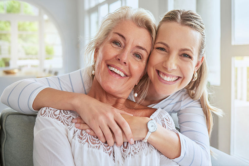 women hug family bond mothers day house living room home women hug family bond mothers day house living room home