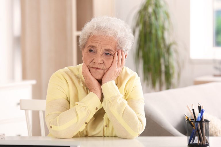 Senior woman sitting at home