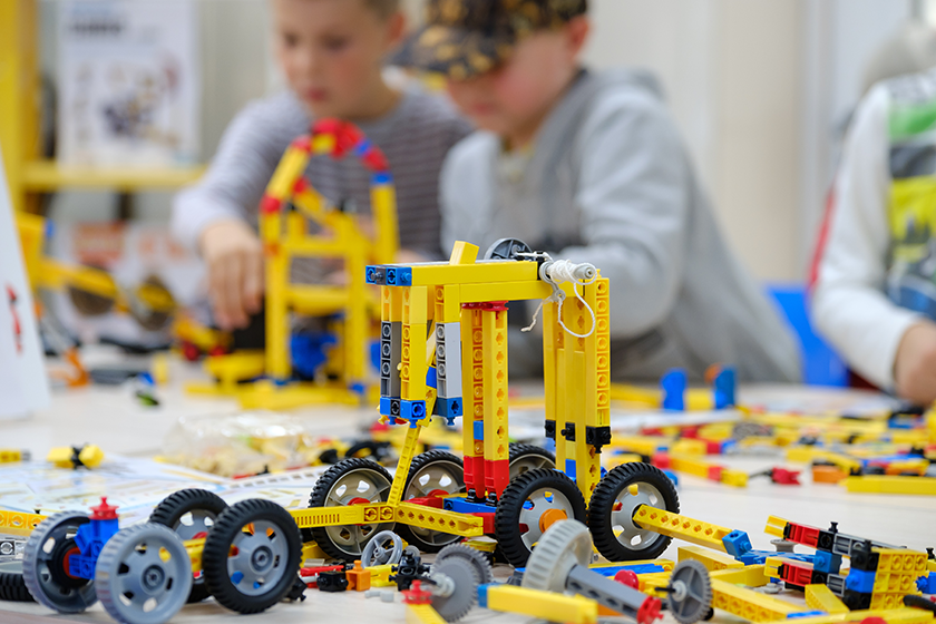 Child plays with a builder kit