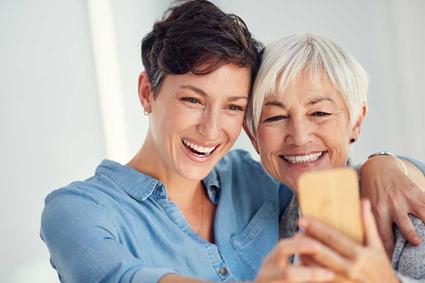 Lets capture our beautiful smiles affectionate young woman taking selfie