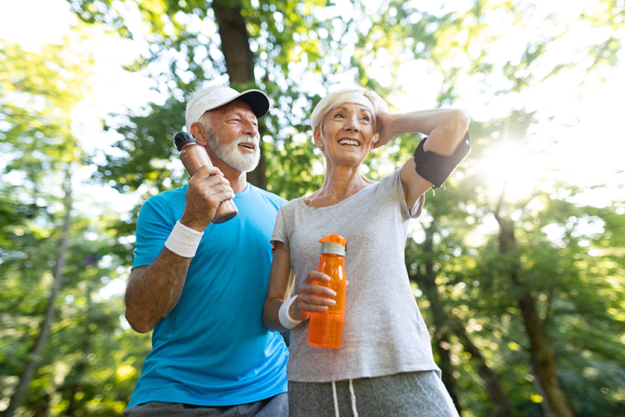 Senior couple drinks water replenish energy hydrate Senior couple drinks water replenish energy hydrate