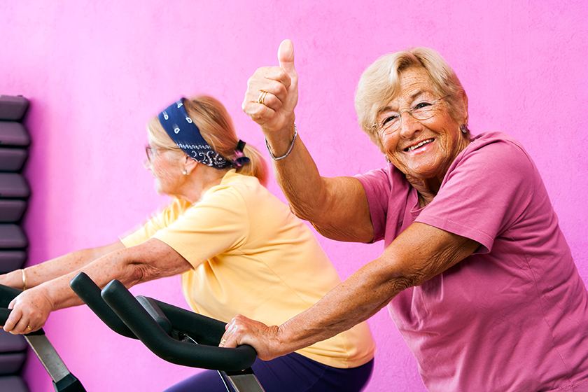 Senior fitness woman doing thumbs up