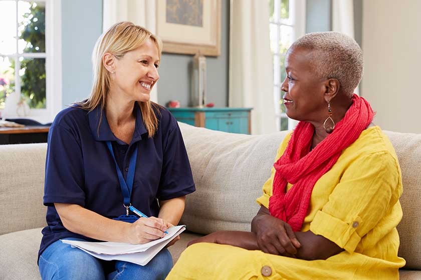 Support worker visits senior woman