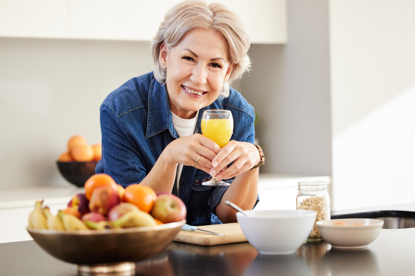 Start the day right. a senior woman drinking a glass of orange juice at home. Start the day right. a senior woman drinking a glass of orange juice at home.