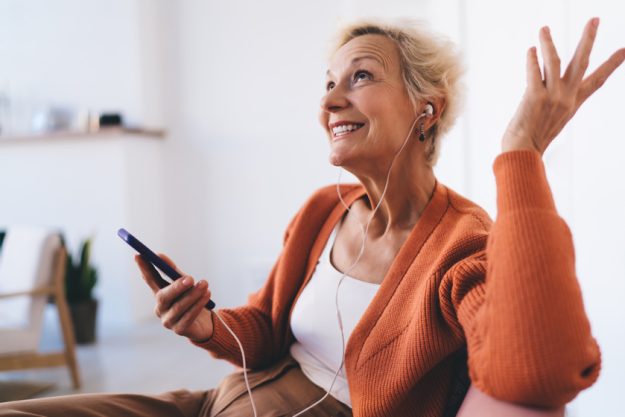 Elderly woman listening to music and relaxing