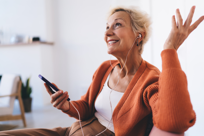 Elderly woman listening to music and relaxing Elderly woman listening to music and relaxing