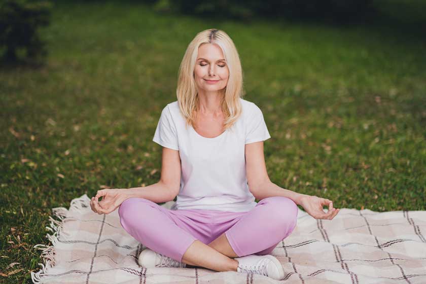 Full body photo of aged rest blond lady sit wear t shirt trousers sneakers in