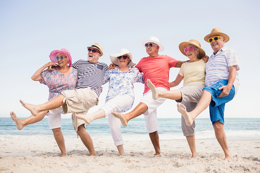 Happy senior friends dancing