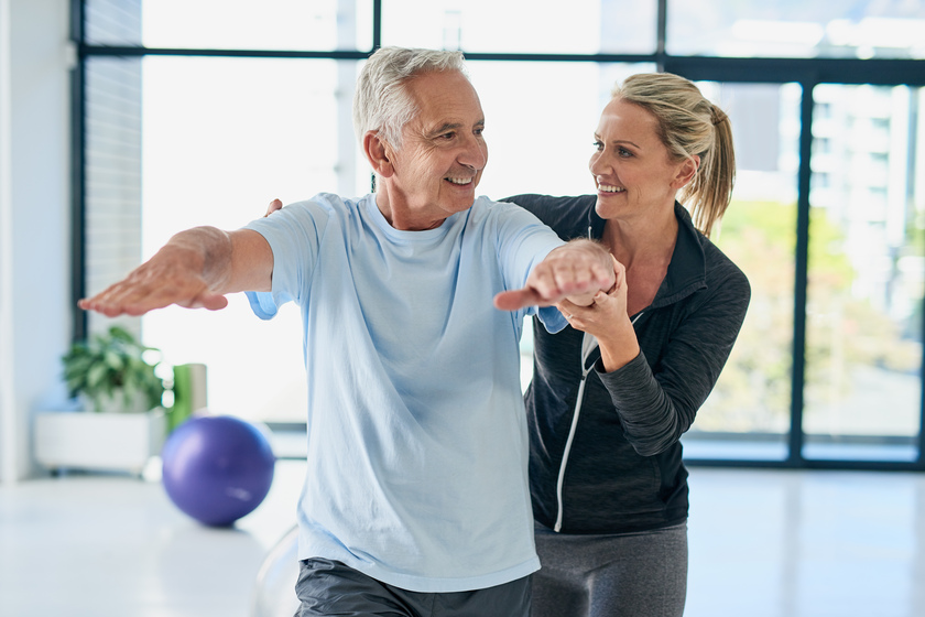 Keep flexible, youre doing good. Cropped shot of a friendly female physiotherapist helping her senior patient with his exercises.