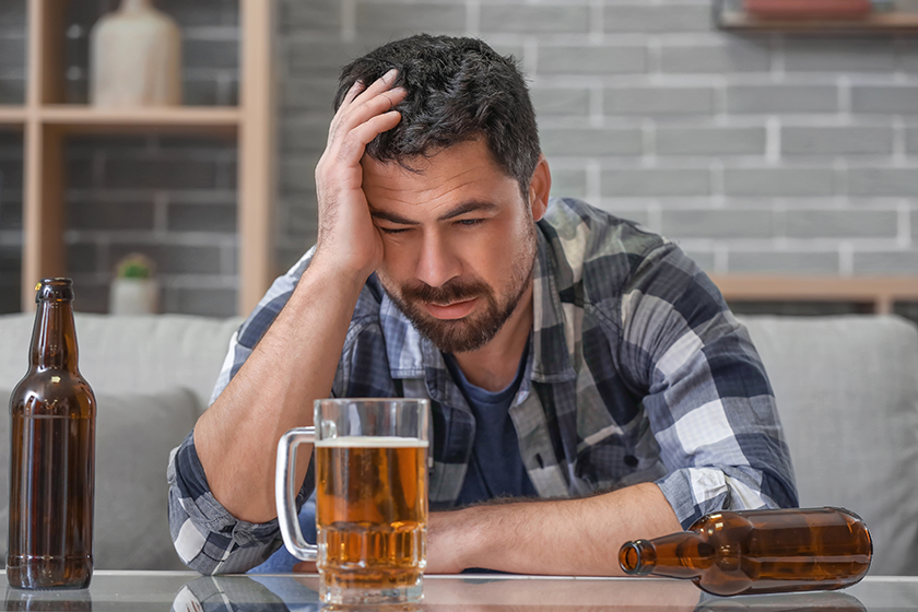 Man drinking beer home concept alcoholism Man drinking beer home concept alcoholism