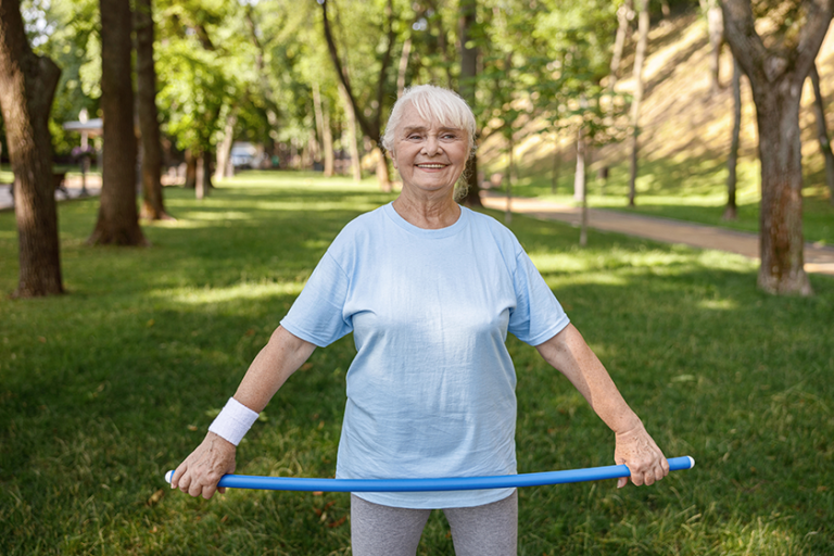 cheerful mature woman holds plastic bar cheerful mature woman holds plastic bar