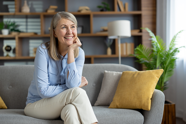 cheerful senior woman sits comfortably cheerful senior woman sits comfortably
