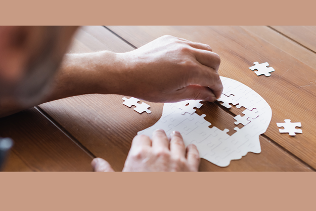 cropped view blurred man dementia folding puzzle banner