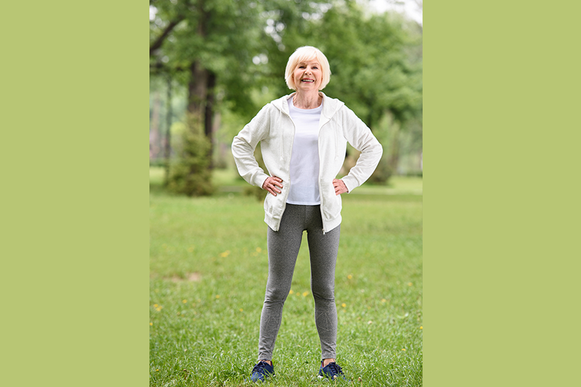 elderly sportswoman standing green lawn elderly sportswoman standing green lawn