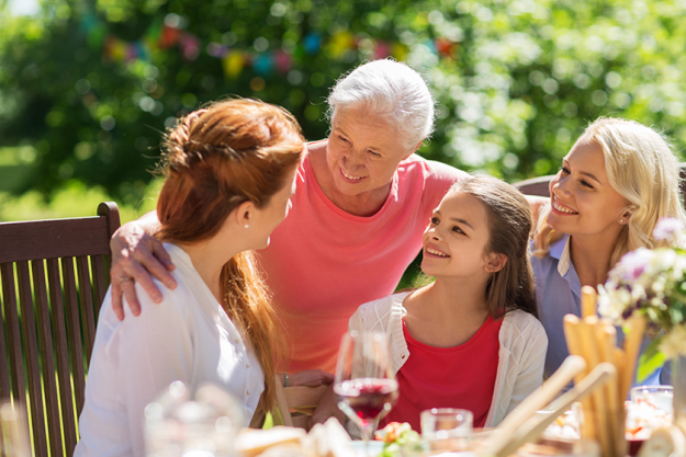 happy family having dinner or summer garden happy family having dinner or summer garden