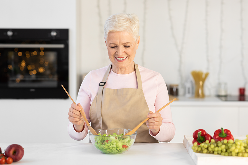 happy mature woman enjoying cooking happy mature woman enjoying cooking