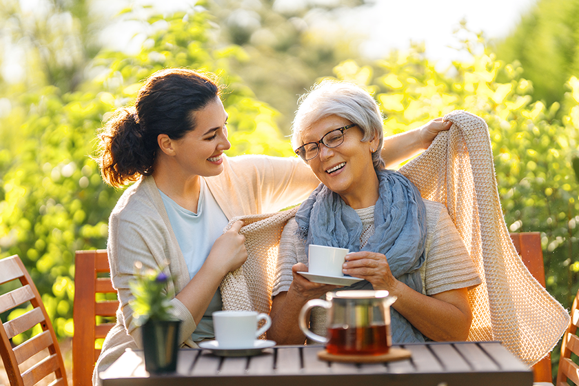 happy young woman her mother drinking tea happy young woman her mother drinking tea