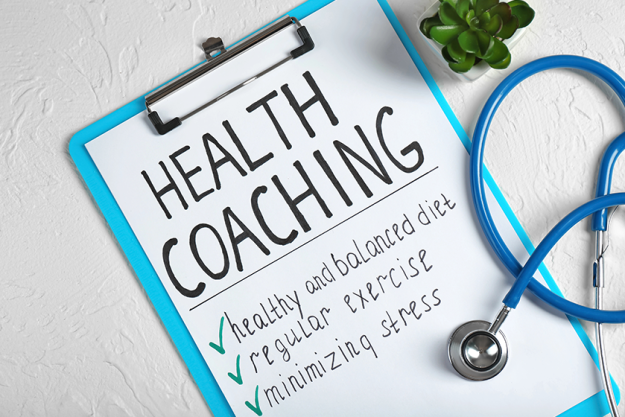 health coaching written on sheet of paper health coaching written on sheet of paper