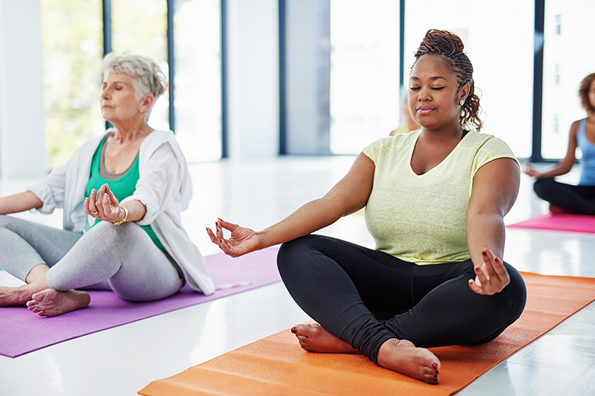 release all your tension shot of a group of women meditating release all your tension shot of a group of women meditating