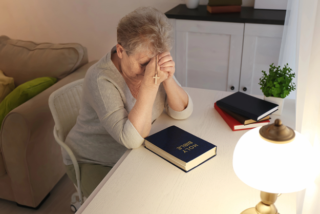 religious elderly woman praying bible religious elderly woman praying bible
