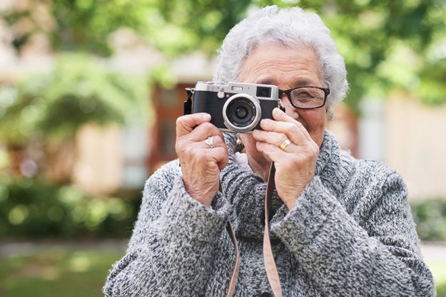 Retirement relax elderly woman photographer hobby enjoy pension leisure garden Retirement relax elderly woman photographer hobby enjoy pension leisure garden