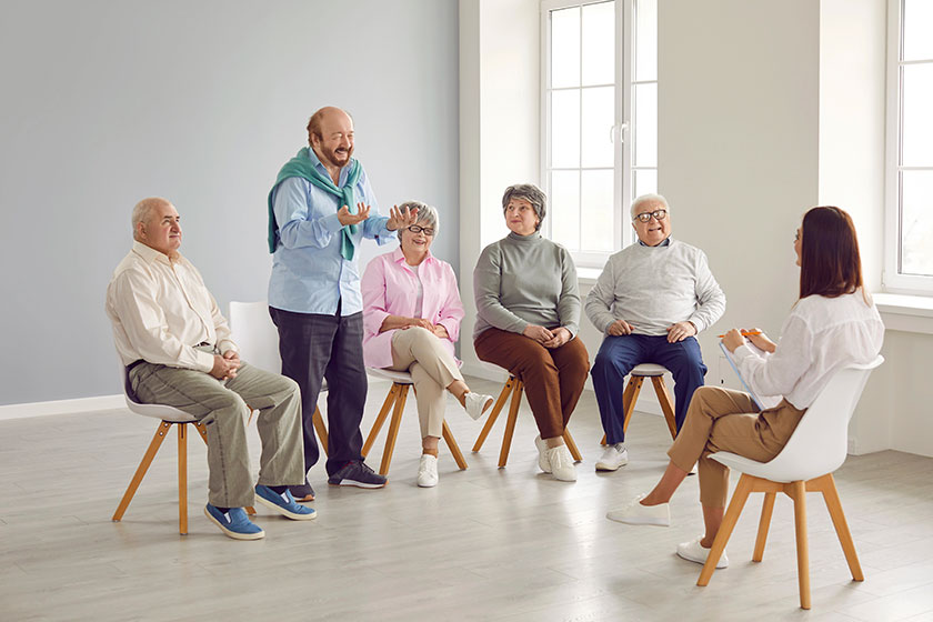 Senior people group therapy happy retired old men women sitting Senior people group therapy happy retired old men women sitting