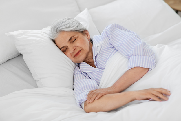 senior woman sleeping in bed